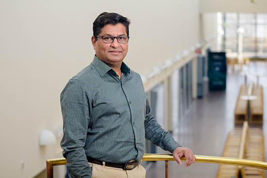 Kamrul Hossain standing at the corridor of the Arktikum building.