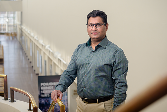 Kamrul Hossain standing at the corridor of the Arktikum building.